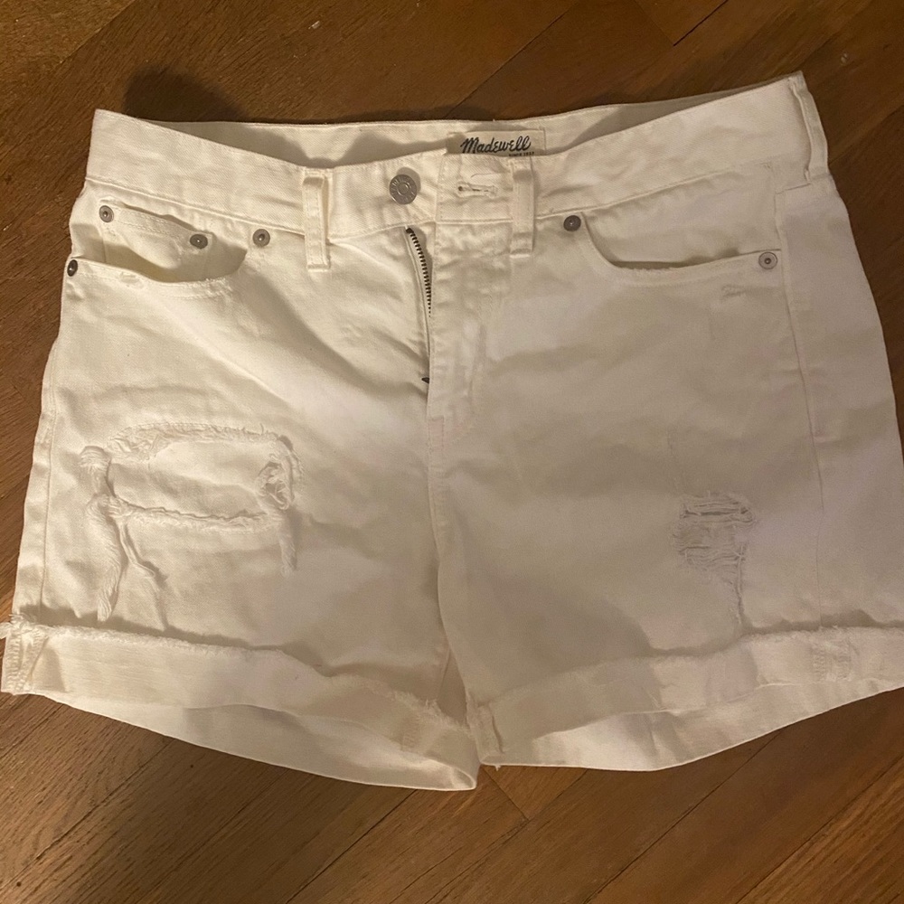 Distressed white jean shorts